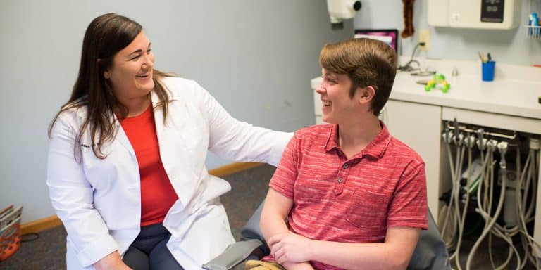 Dentist with dental patient at Buckeye Pediatric Dentistry in Reynoldsburg