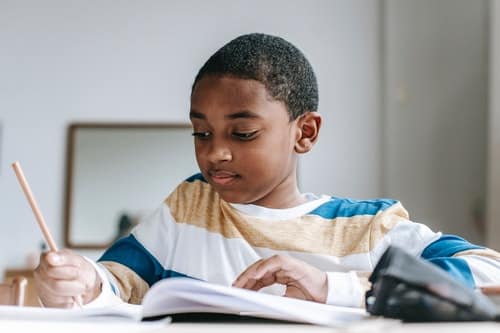 boy doing schoolwork