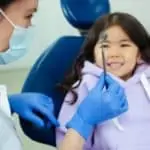 young girl at the dentist