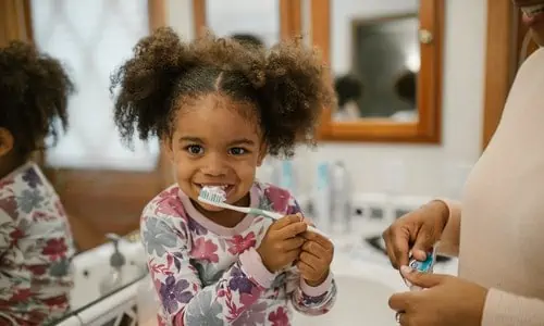 kid brushing teeth